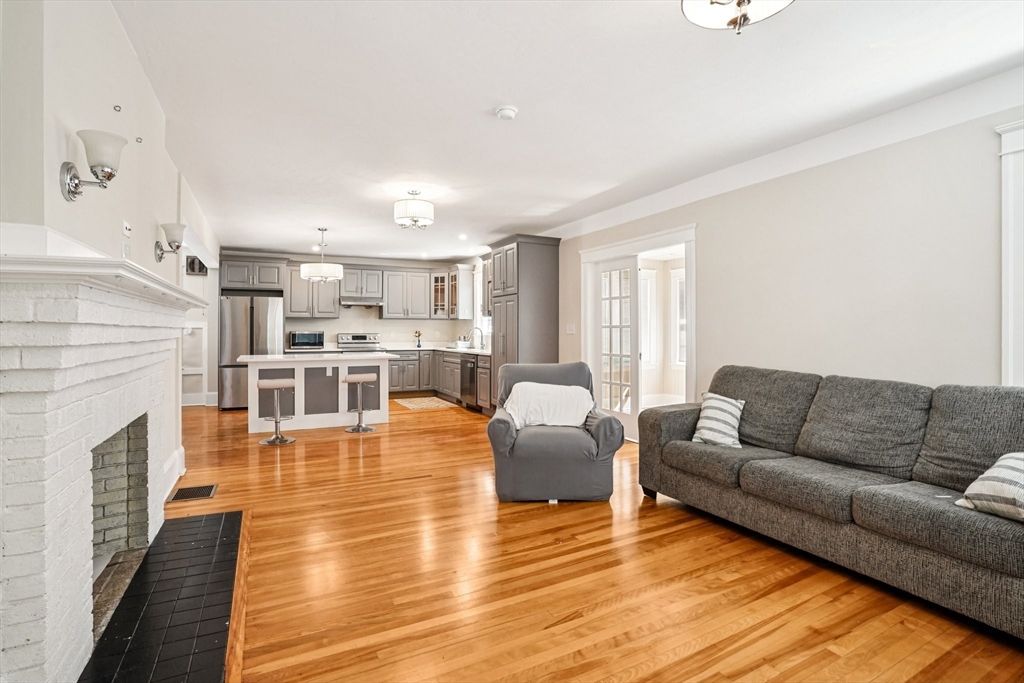 Fireplace, Interior, Kitchen, Living room, Pendant Lights, Stainless Steel Appliances, Wood Texture Flooring