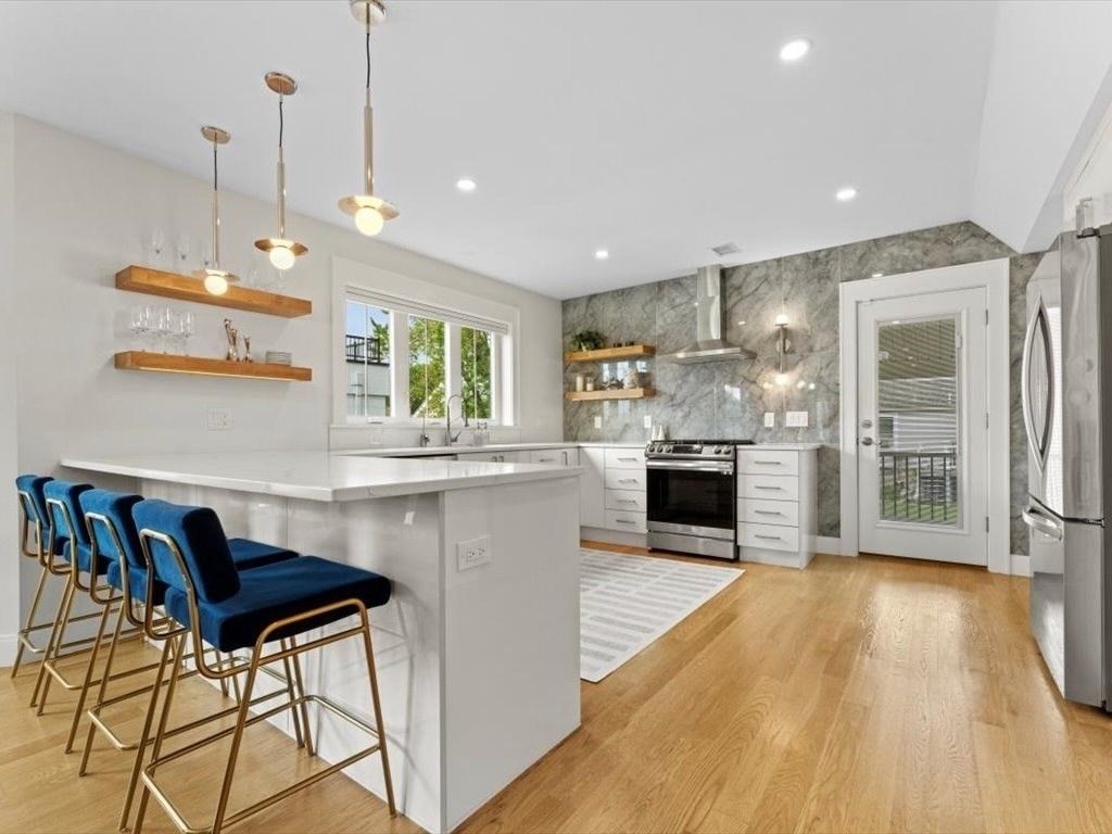 Interior, Kitchen, Marble Walls, Pendant Lights, Recessed Lighting, Stainless Steel Appliances, Wood Texture Flooring