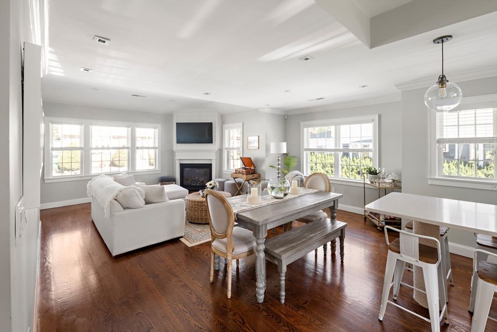Dining room, Fireplace, Interior, Living room, Pendant Lights, Recessed Lighting, Wood Texture Flooring