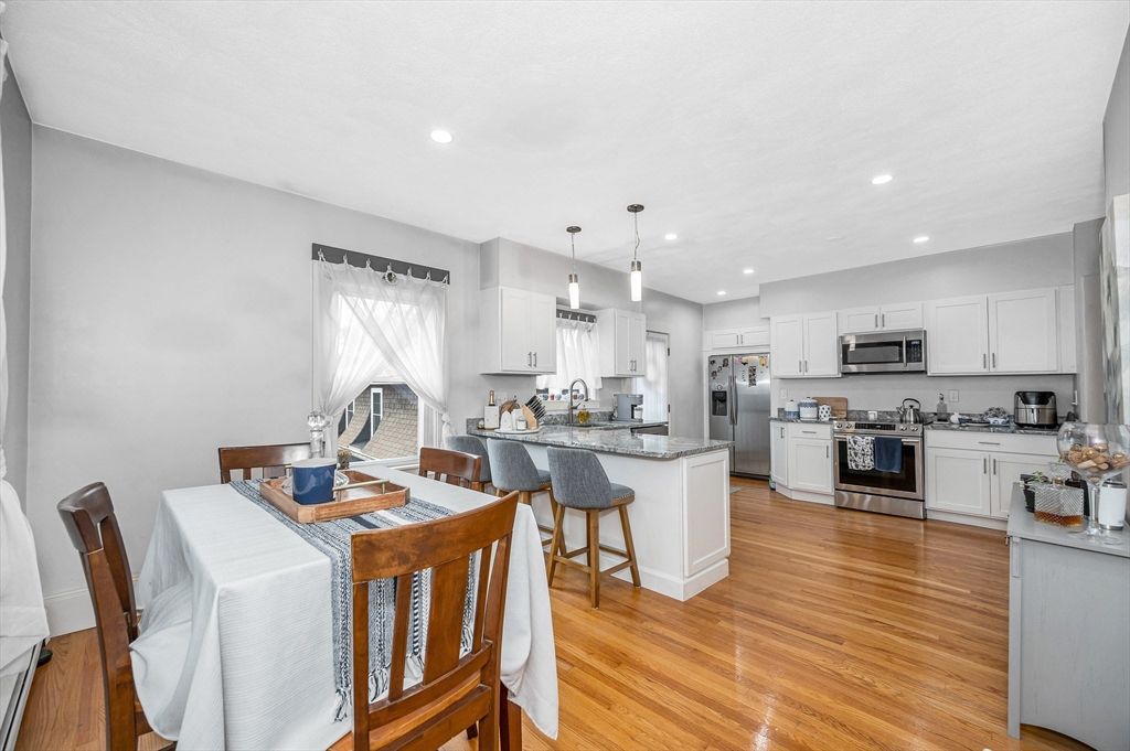 Dining room, Interior, Kitchen, Pendant Lights, Recessed Lighting, Stainless Steel Appliances, Wood Texture Flooring