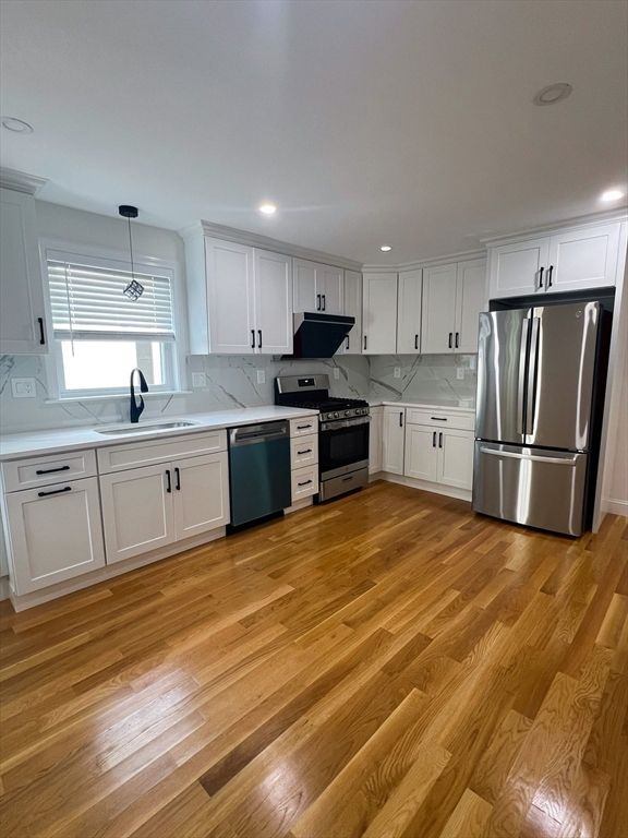 Interior, Kitchen, Marble Walls, Recessed Lighting, Stainless Steel Appliances, Wood Texture Flooring