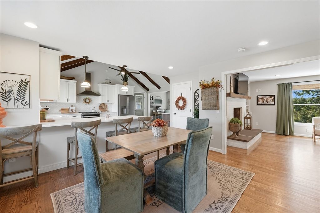Dining room, Fireplace, Interior, Kitchen, Pendant Lights, Recessed Lighting, Stainless Steel Appliances, Wooden Beams, Wood Texture Flooring