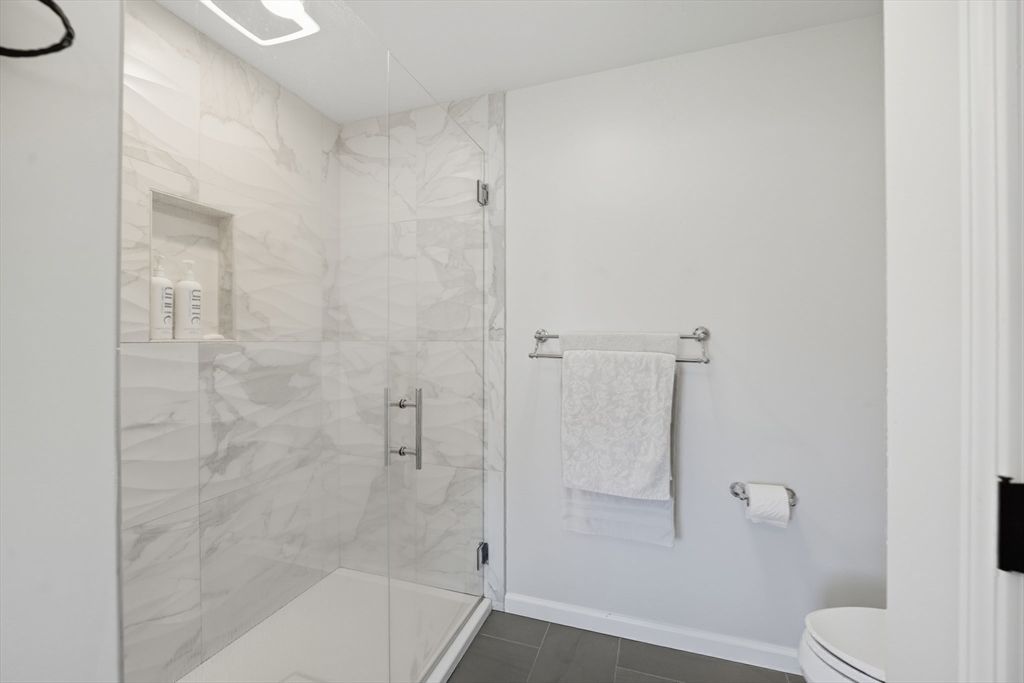 Bathroom, Glass Shower, Interior, Marble Walls, Wood Texture Flooring