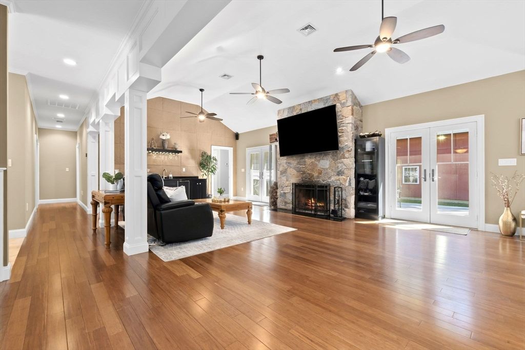 Fireplace, Interior, Living room, Recessed Lighting, Stone Walls, Wood Texture Flooring