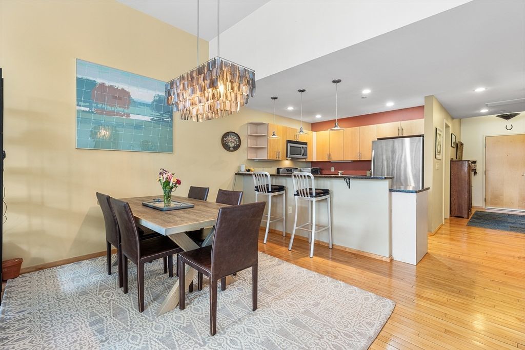 Chandelier, Dining room, Interior, Kitchen, Pendant Lights, Recessed Lighting, Stainless Steel Appliances, Wood Texture Flooring
