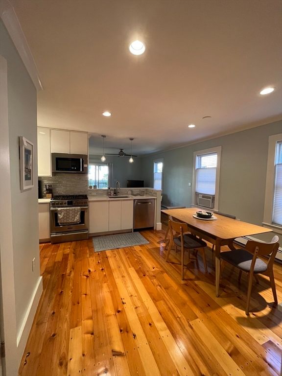 Dining room, Interior, Kitchen, Pendant Lights, Recessed Lighting, Stainless Steel Appliances, Wood Texture Flooring
