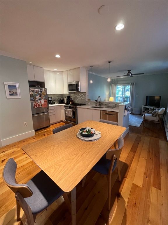 Dining room, Interior, Kitchen, Pendant Lights, Recessed Lighting, Stainless Steel Appliances, Wood Texture Flooring