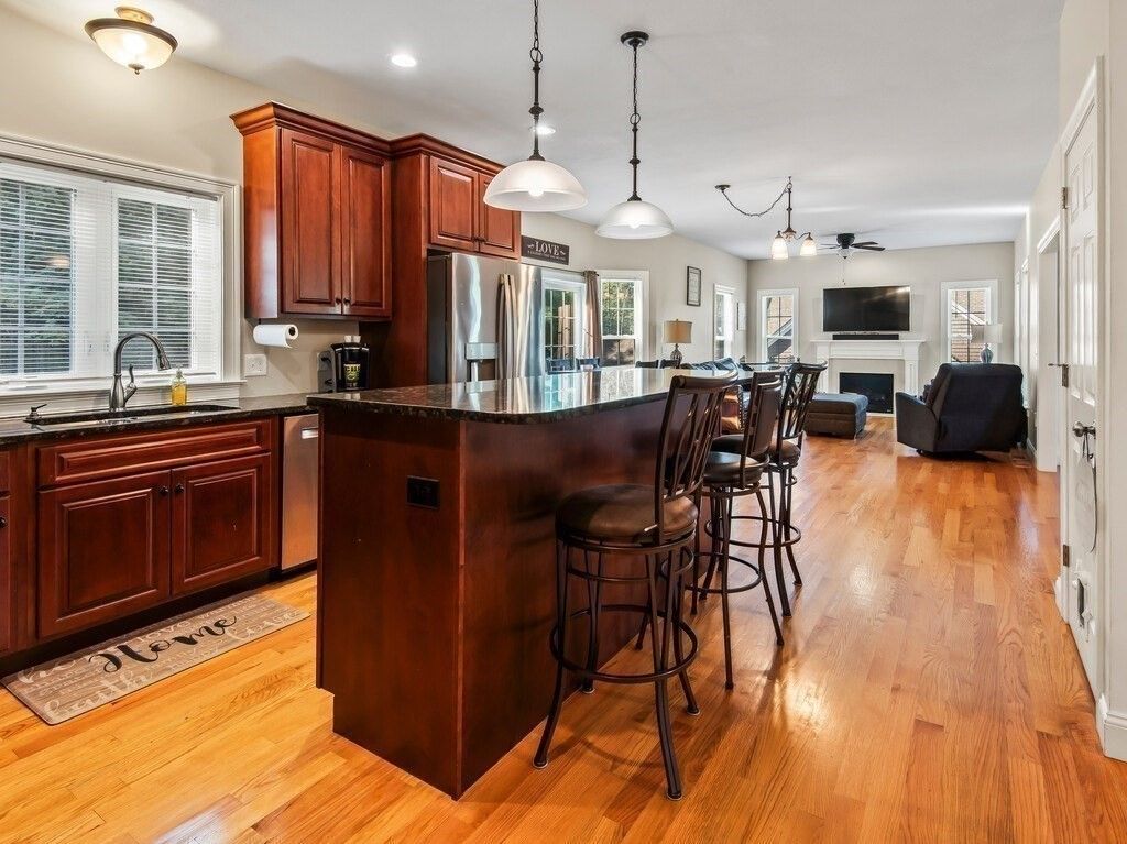Fireplace, Interior, Kitchen, Living room, Pendant Lights, Recessed Lighting, Stainless Steel Appliances, Wood Texture Flooring