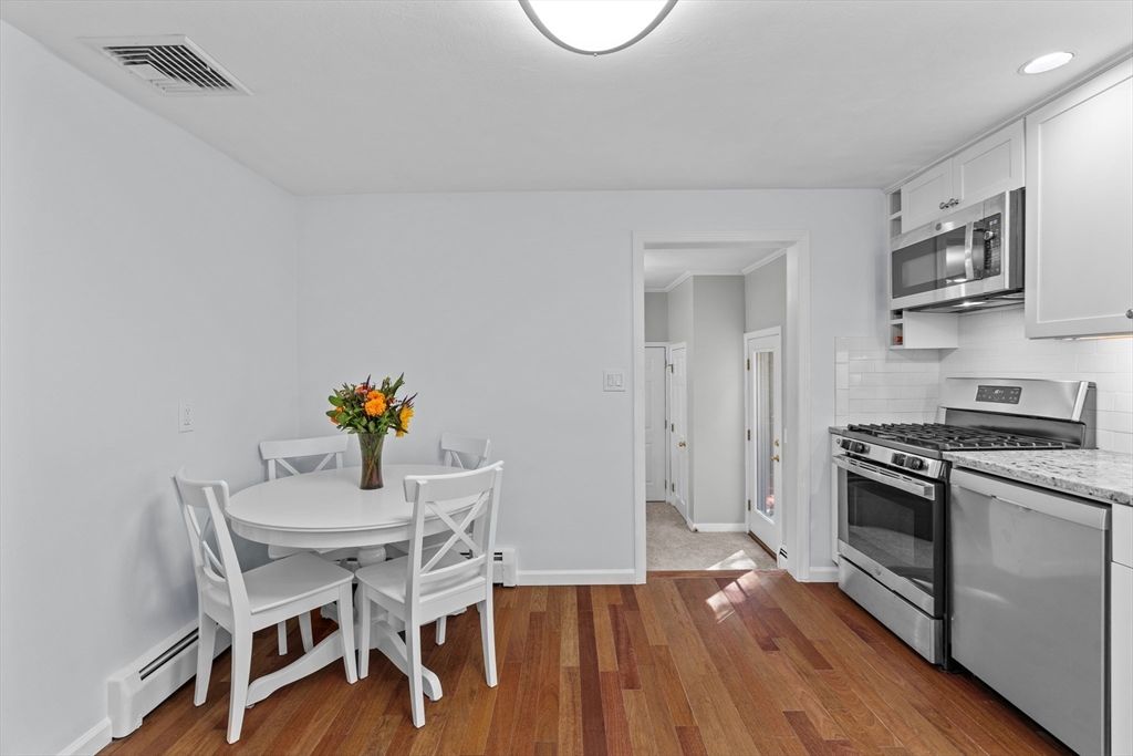 Dining room, Interior, Kitchen, Recessed Lighting, Stainless Steel Appliances, Wood Texture Flooring