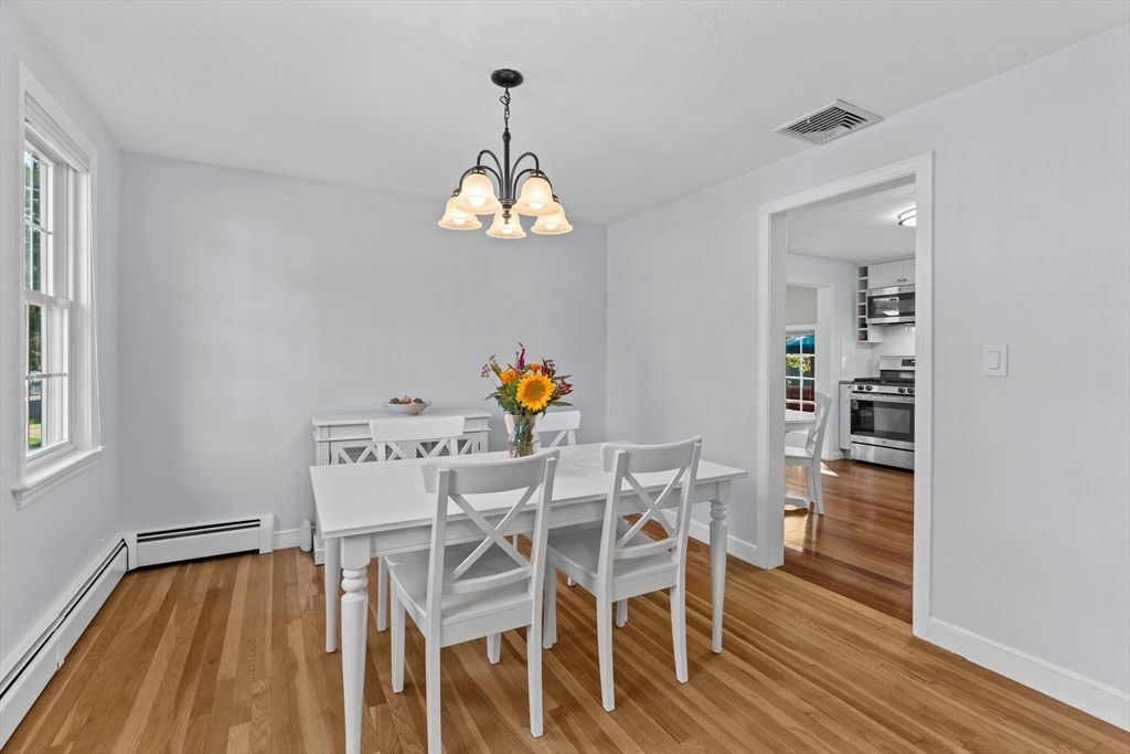 Chandelier, Dining room, Interior, Kitchen, Stainless Steel Appliances, Wood Texture Flooring