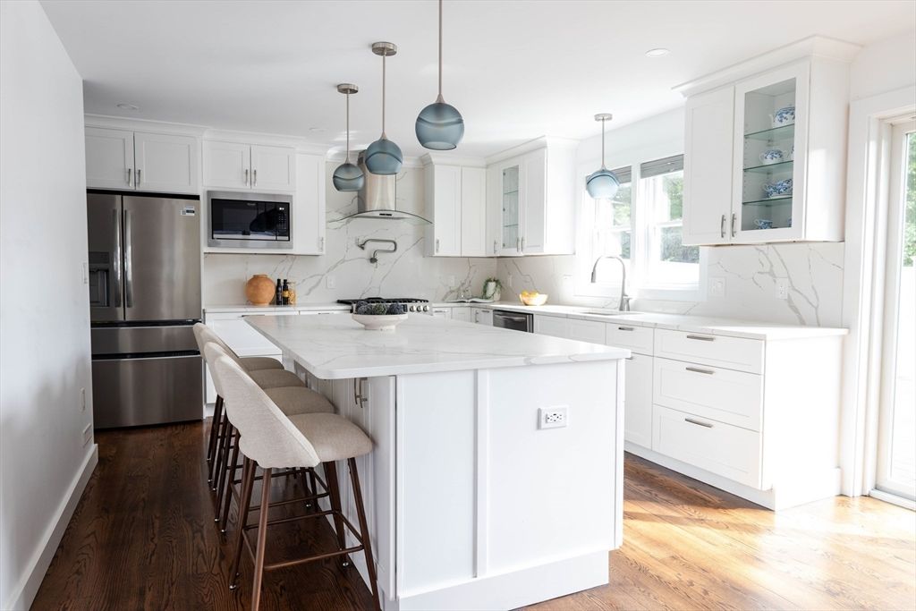 Interior, Kitchen, Marble Walls, Pendant Lights, Recessed Lighting, Stainless Steel Appliances, Wood Texture Flooring