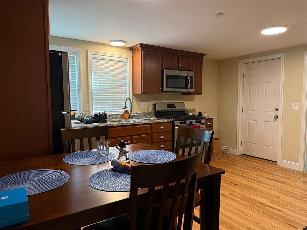 Dining room, Interior, Kitchen, Recessed Lighting, Stainless Steel Appliances, Wood Texture Flooring