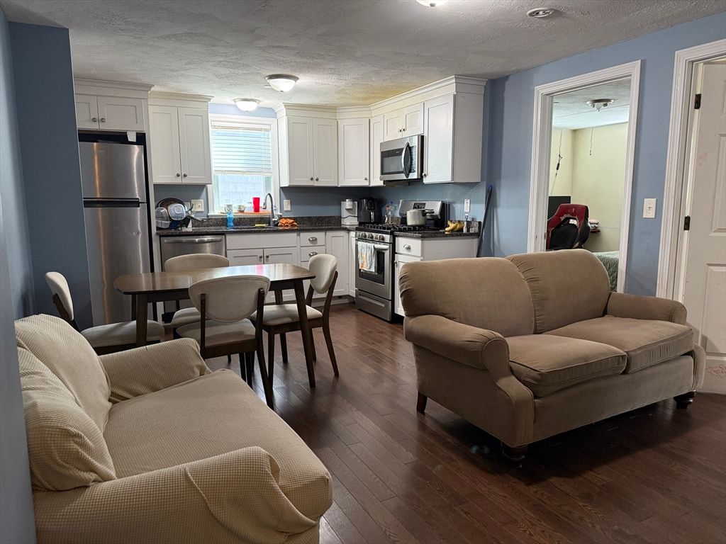 Dining room, Interior, Kitchen, Living room, Stainless Steel Appliances, Wood Texture Flooring