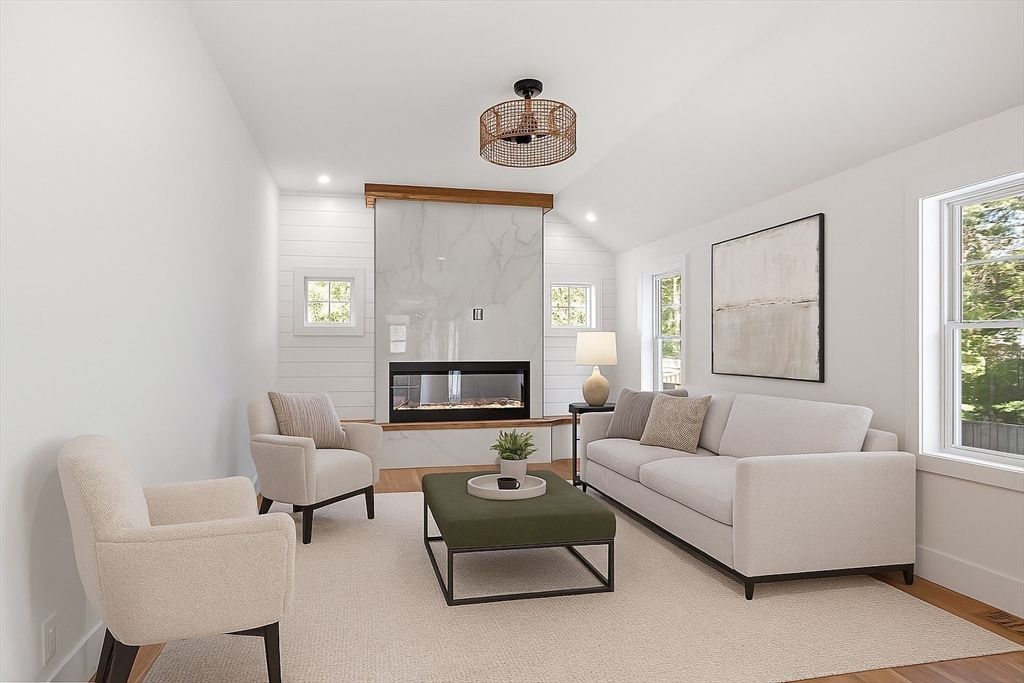 Fireplace, Interior, Living room, Marble Walls, Recessed Lighting, Wood Texture Flooring