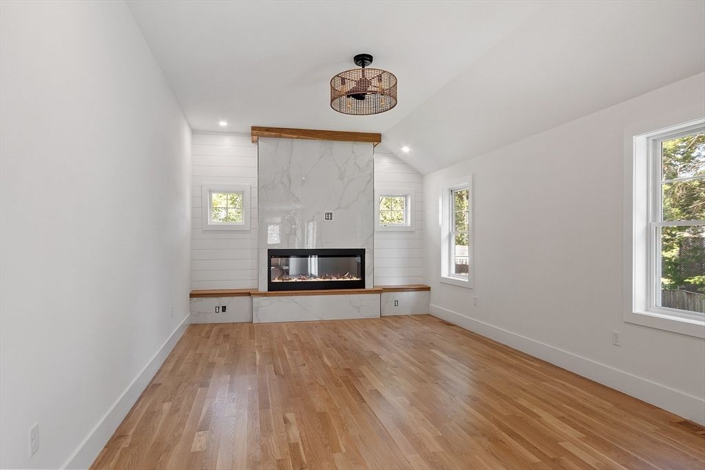 Empty room, Fireplace, Interior, Marble Walls, Recessed Lighting, Wood Texture Flooring