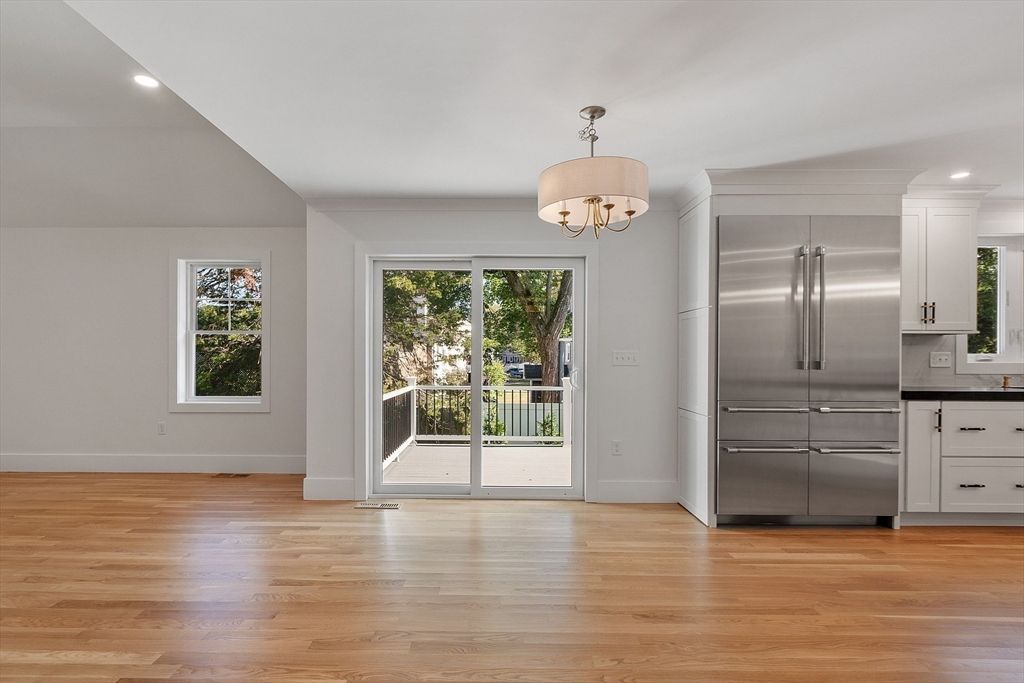 Chandelier, Empty room, Interior, Kitchen, Recessed Lighting, Stainless Steel Appliances, Wood Texture Flooring