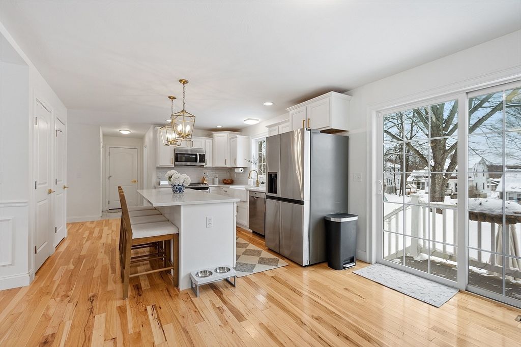 Chandelier, Dining room, Interior, Kitchen, Pendant Lights, Recessed Lighting, Stainless Steel Appliances, Wood Texture Flooring