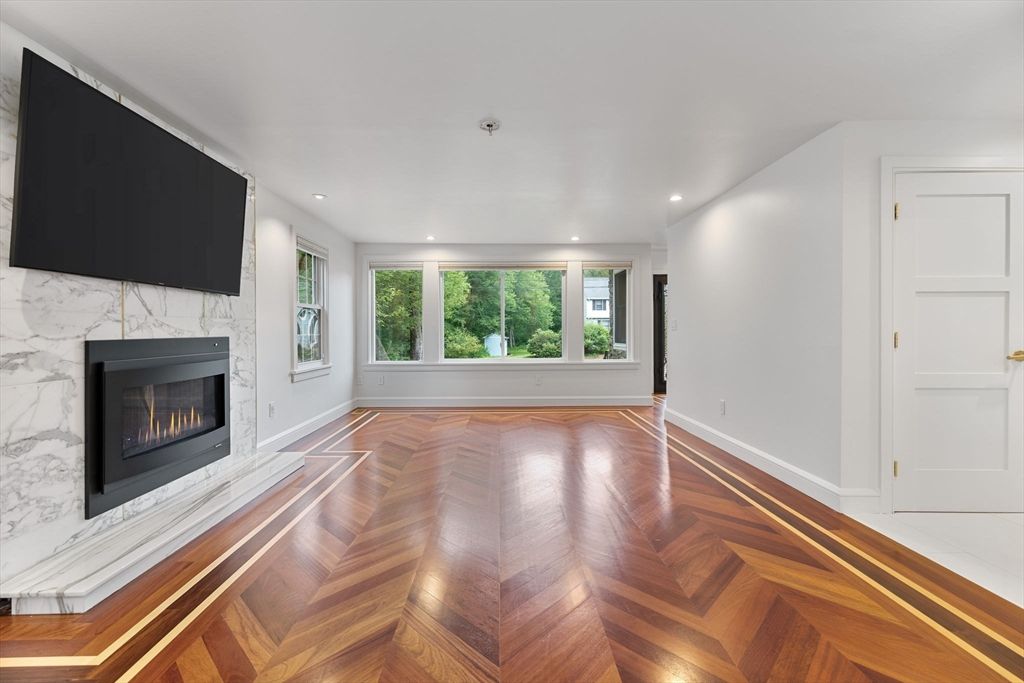 Empty room, Fireplace, Interior, Marble Walls, Recessed Lighting, Wood Texture Flooring