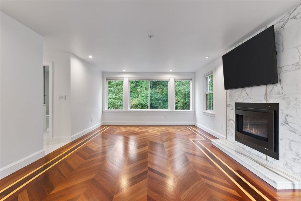 Empty room, Fireplace, Interior, Marble Walls, Recessed Lighting, Wood Texture Flooring