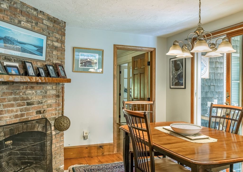 Chandelier, Dining room, Fireplace, Interior, Stone Walls, Wood Texture Flooring