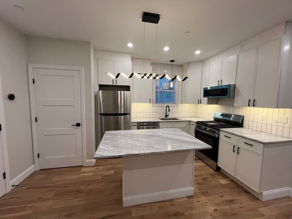 Interior, Kitchen, Pendant Lights, Recessed Lighting, Stainless Steel Appliances, Wood Texture Flooring