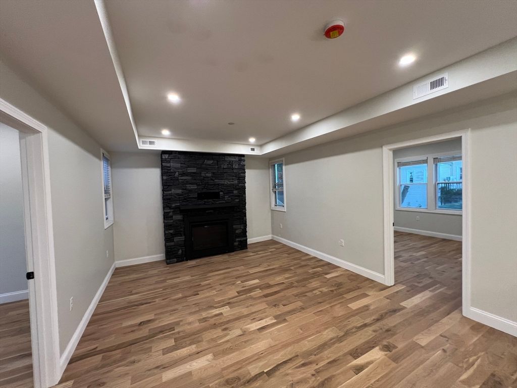 Empty room, Fireplace, Interior, Recessed Lighting, Wood Texture Flooring