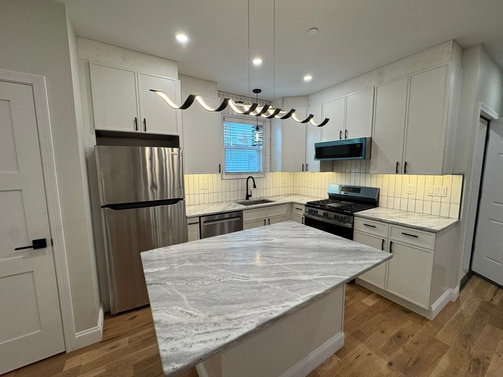 Interior, Kitchen, Pendant Lights, Recessed Lighting, Stainless Steel Appliances, Wood Texture Flooring