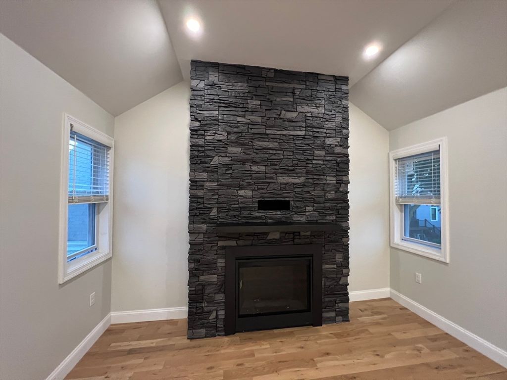 Empty room, Fireplace, Interior, Recessed Lighting, Stone Walls, Wood Texture Flooring
