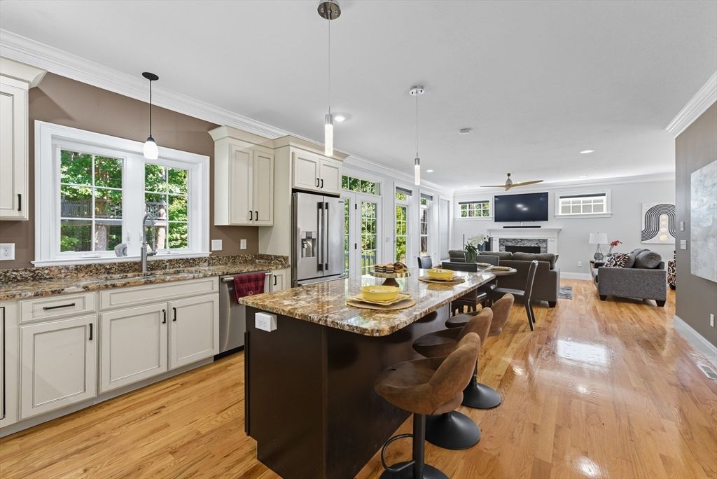 Dining room, Fireplace, Interior, Kitchen, Living room, Pendant Lights, Recessed Lighting, Stainless Steel Appliances, Wood Texture Flooring