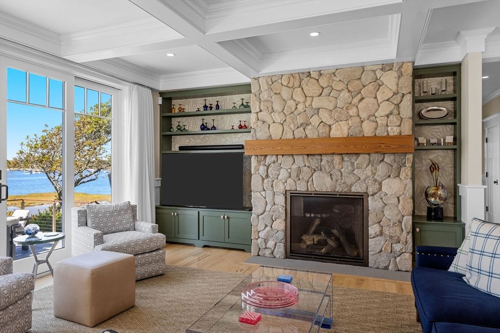 Fireplace, Interior, Living room, Recessed Lighting, Stone Walls, Water, Wood Texture Flooring
