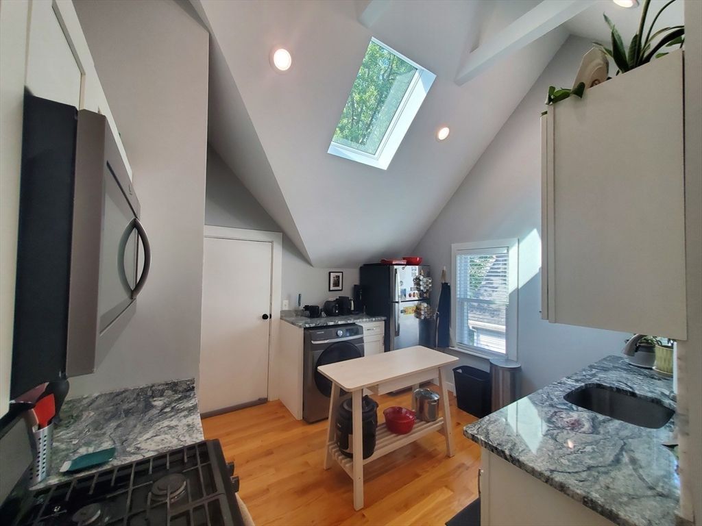 Interior, Kitchen, Recessed Lighting, Washer, Wood Texture Flooring