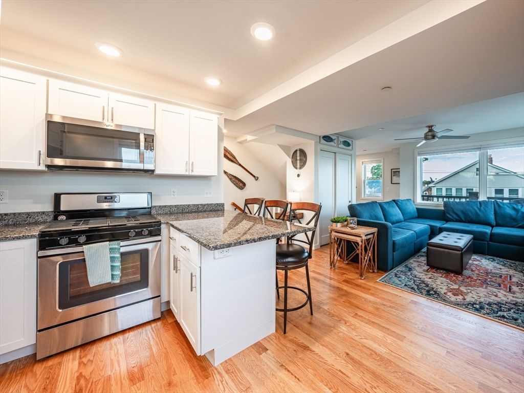 Dining room, Interior, Kitchen, Living room, Recessed Lighting, Stainless Steel Appliances, Wood Texture Flooring