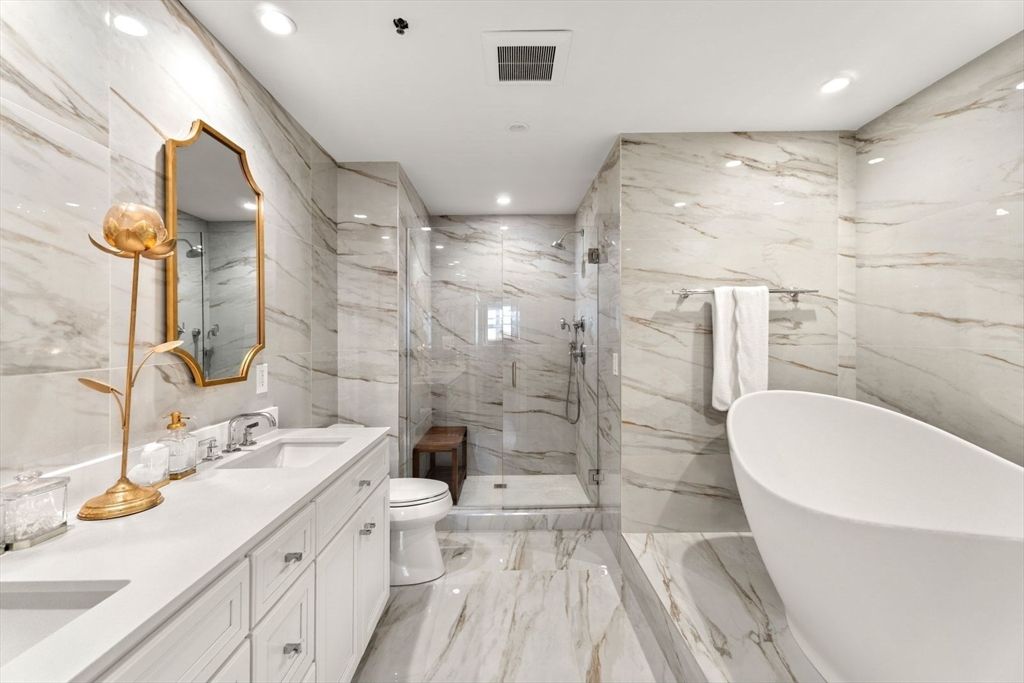 Bathroom, Dual Sink Vanities, Free Standing Baths, Glass Shower, Interior, Marble, Marble Walls, Recessed Lighting