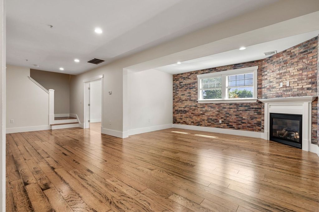 Empty room, Fireplace, Interior, Recessed Lighting, Stone Walls, Wood Texture Flooring