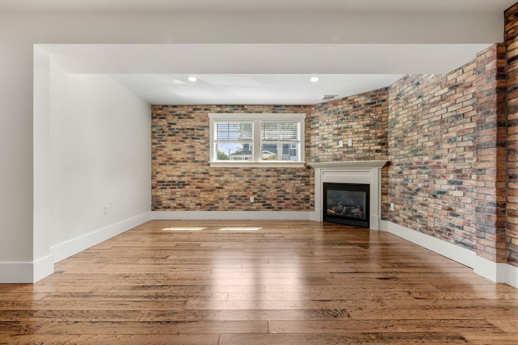 Empty room, Fireplace, Interior, Recessed Lighting, Stone Walls, Wood Texture Flooring