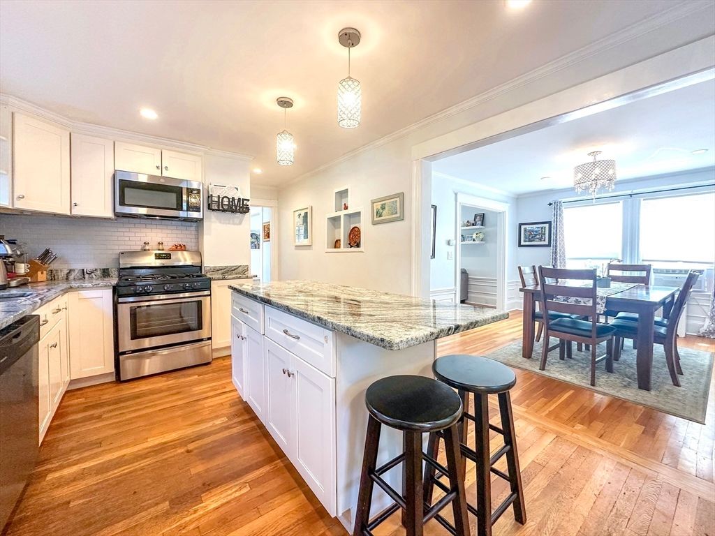 Chandelier, Dining room, Interior, Kitchen, Pendant Lights, Recessed Lighting, Stainless Steel Appliances, Wood Texture Flooring