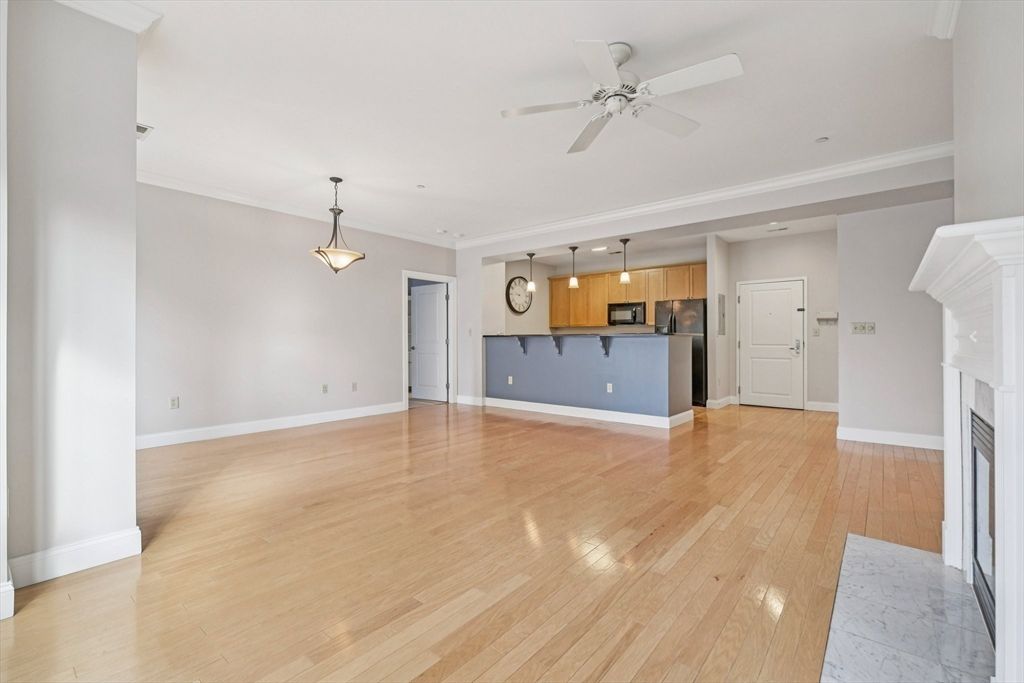 Empty room, Fireplace, Interior, Kitchen, Pendant Lights, Recessed Lighting, Wood Texture Flooring