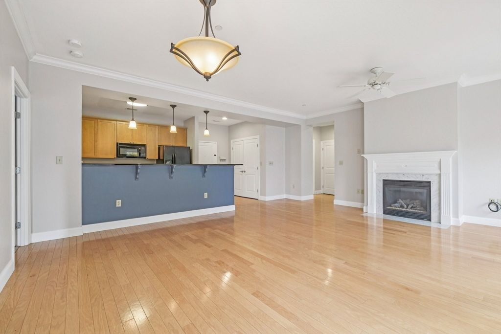 Empty room, Fireplace, Interior, Kitchen, Pendant Lights, Recessed Lighting, Wood Texture Flooring