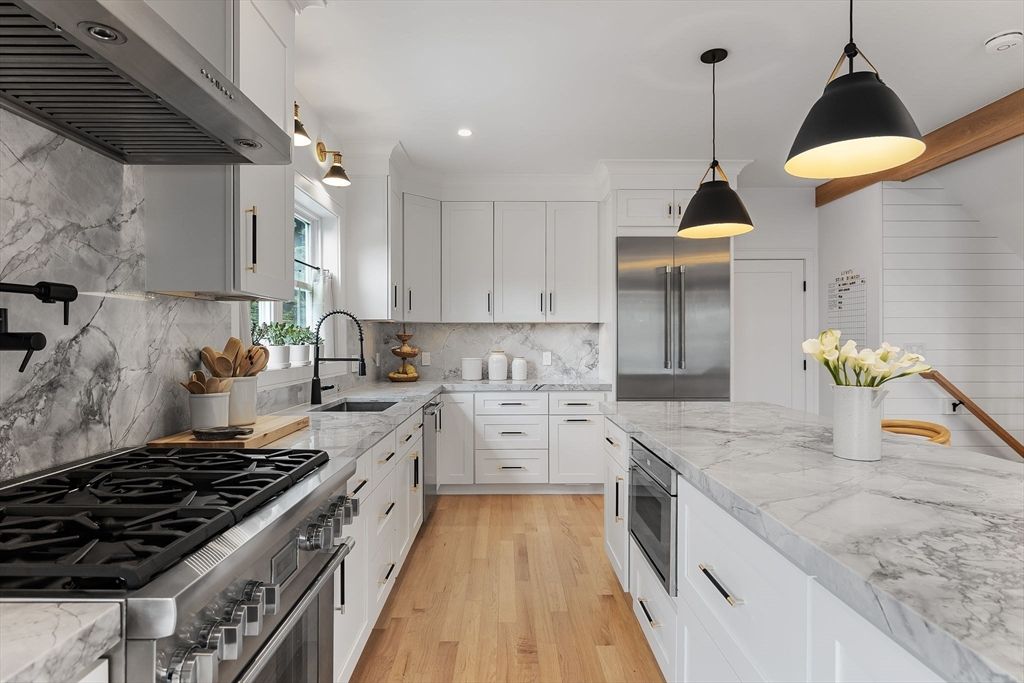 Interior, Kitchen, Marble Walls, Pendant Lights, Recessed Lighting, Stainless Steel Appliances, Wood Texture Flooring
