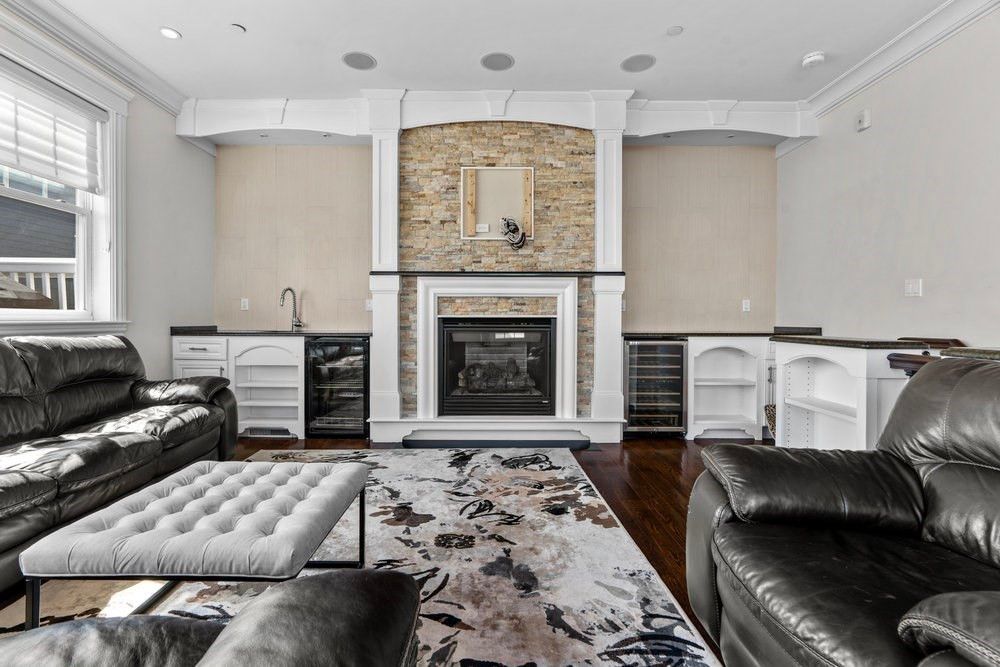 Fireplace, Interior, Living room, Recessed Lighting, Stone Walls, Wood Texture Flooring