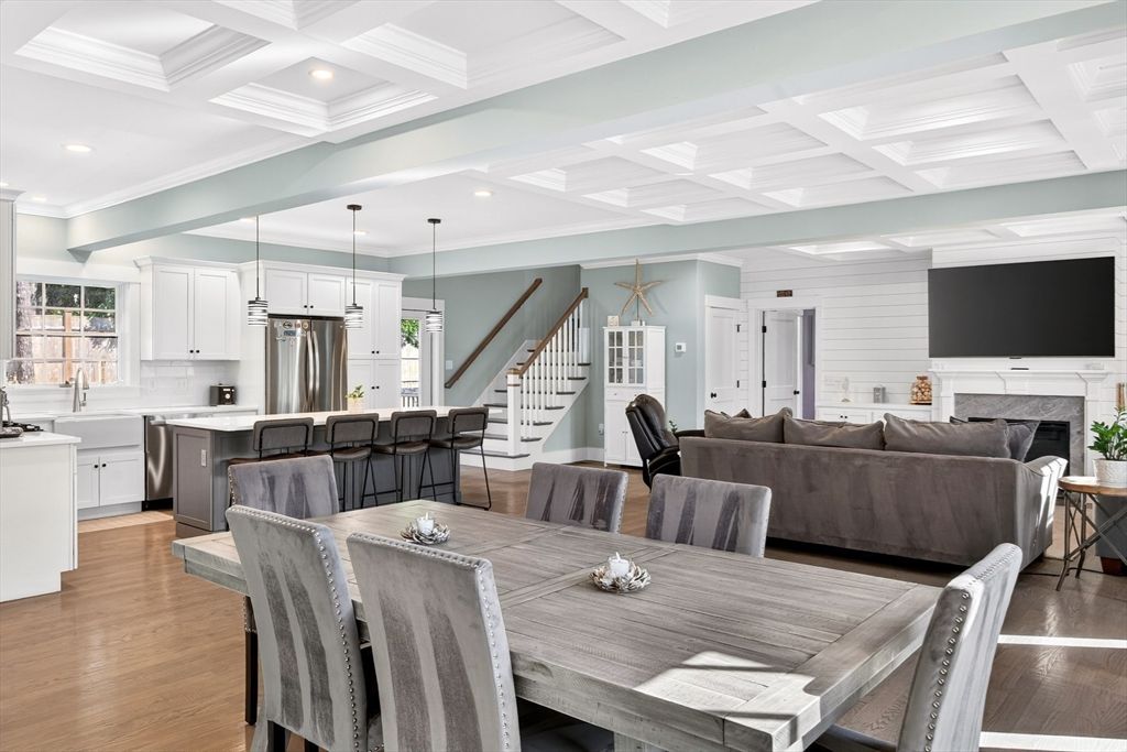 Dining room, Fireplace, Interior, Kitchen, Living room, Pendant Lights, Recessed Lighting, Stainless Steel Appliances, Wood Texture Flooring