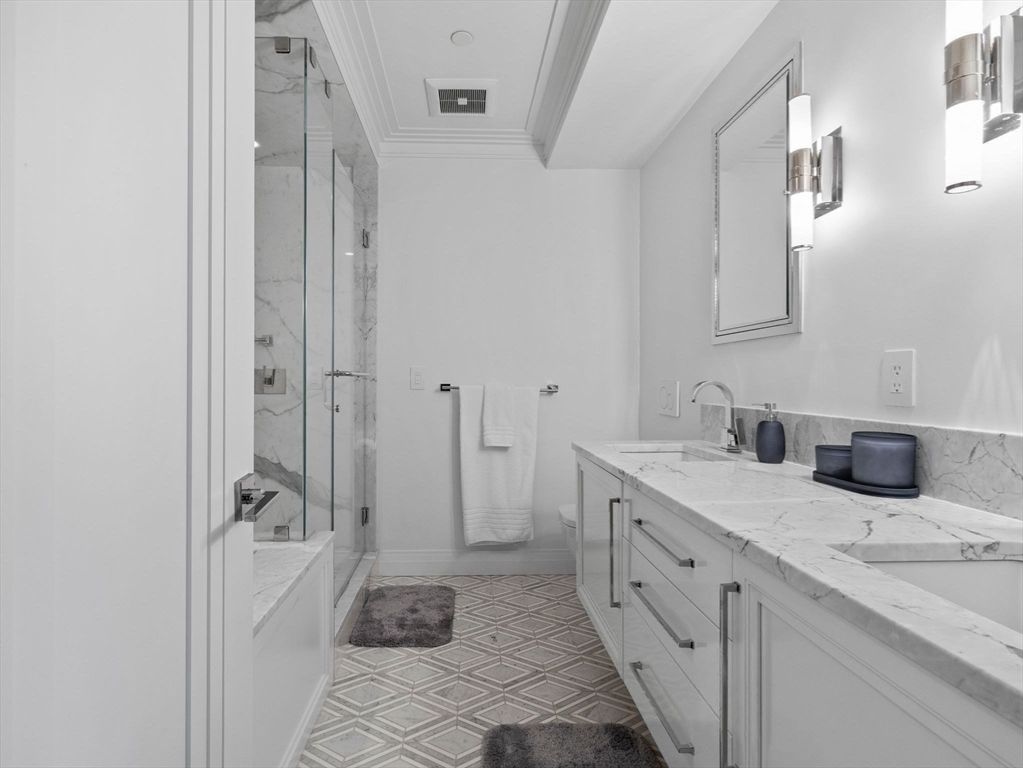 Bathroom, Dual Sink Vanities, Glass Shower, Interior, Marble Walls, Recessed Lighting