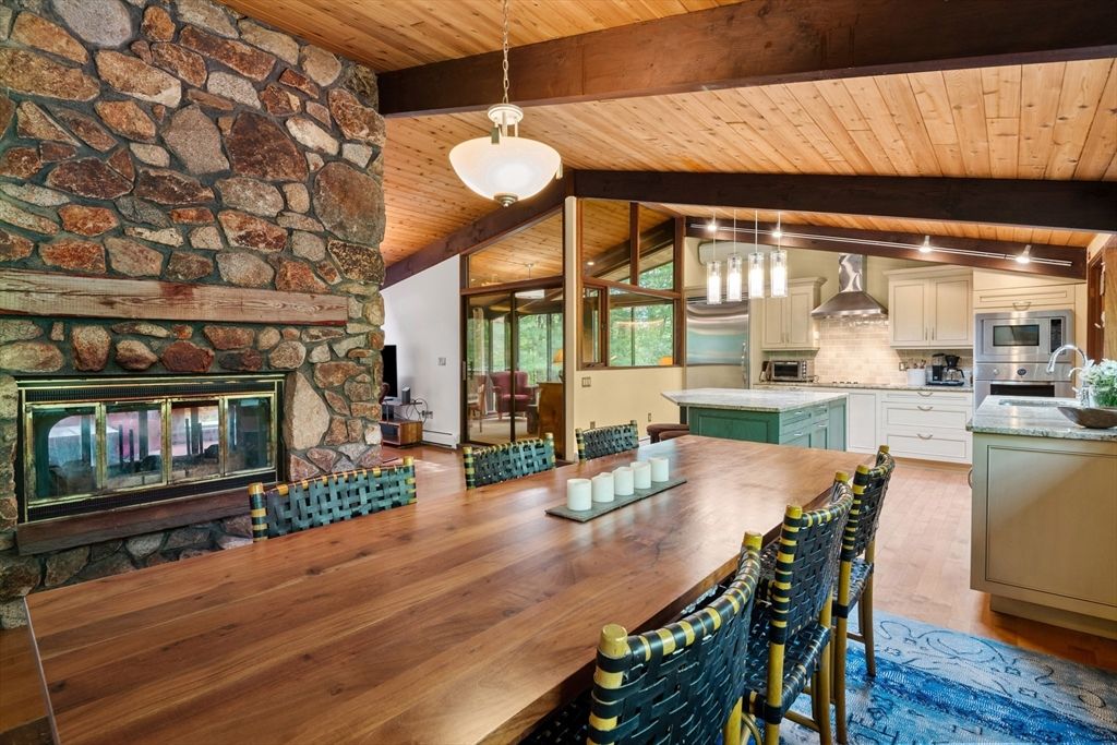 Dining room, Fireplace, Interior, Kitchen, Pendant Lights, Stainless Steel Appliances, Stone Walls, Wooden Beams, Wooden Ceilings, Wood Texture Flooring