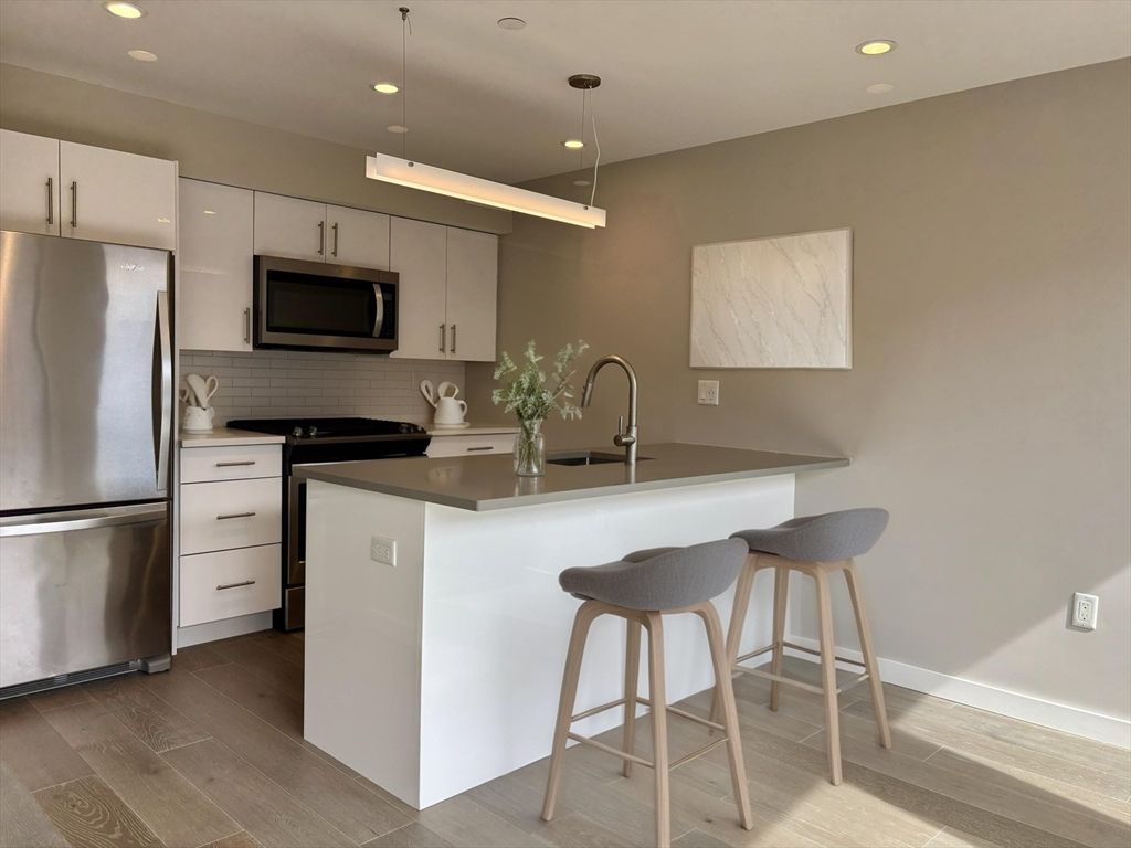 Interior, Kitchen, Pendant Lights, Recessed Lighting, Stainless Steel Appliances, Wood Texture Flooring