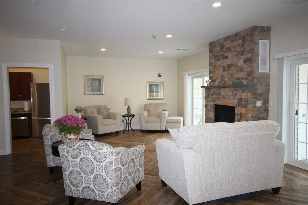 Fireplace, Interior, Living room, Recessed Lighting, Stone Walls, Wood Texture Flooring