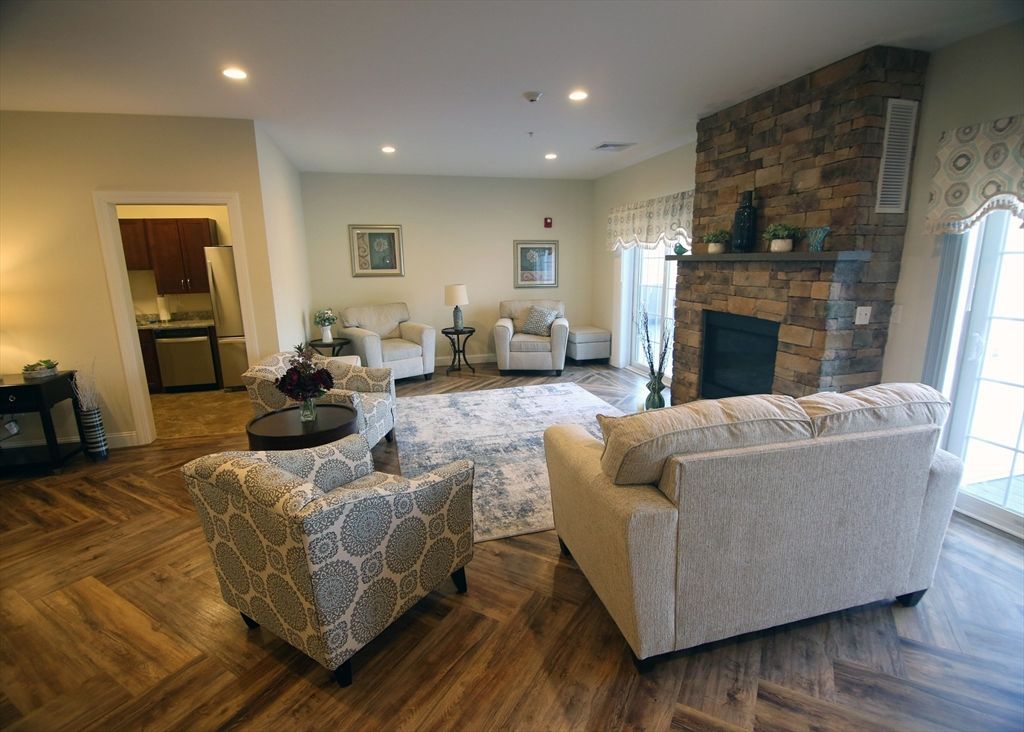 Fireplace, Interior, Living room, Recessed Lighting, Stone Walls, Wood Texture Flooring