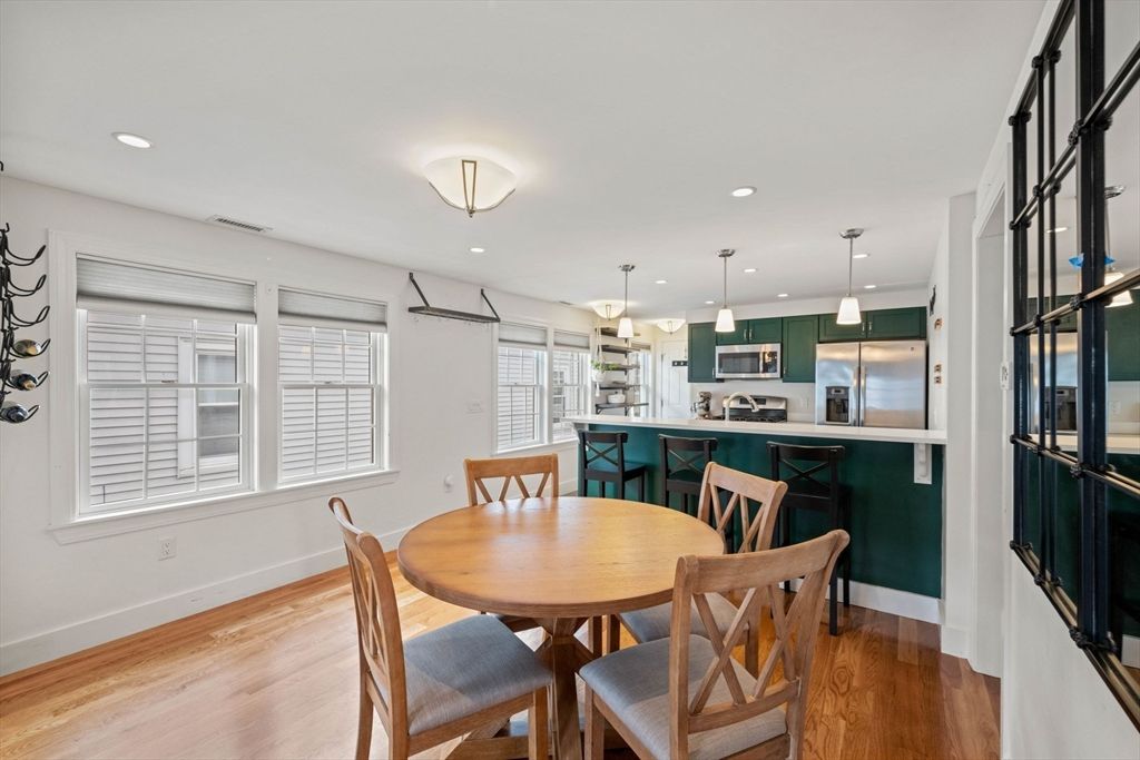 Dining room, Interior, Kitchen, Pendant Lights, Recessed Lighting, Stainless Steel Appliances, Wood Texture Flooring