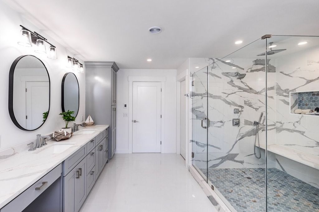Bathroom, Dual Sink Vanities, Glass Shower, Interior, Marble Walls, Recessed Lighting