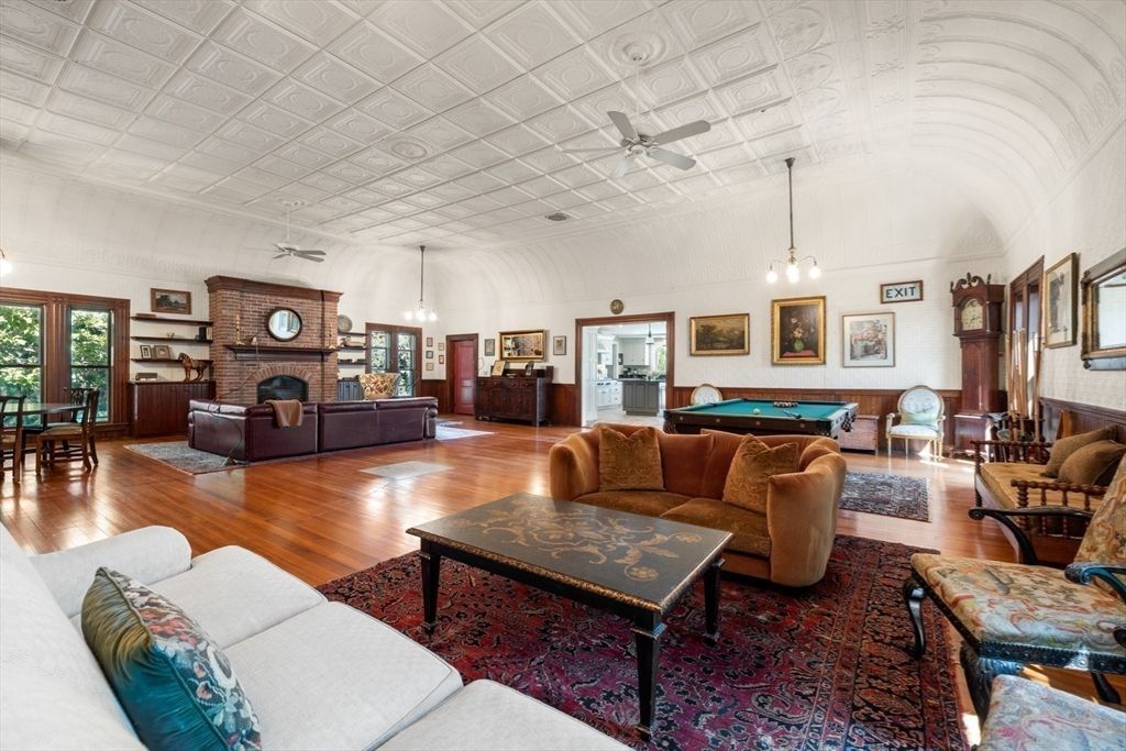 Billiard Table, Fireplace, Game Room, Interior, Living room, Pendant Lights, Stone Walls, Wood Texture Flooring