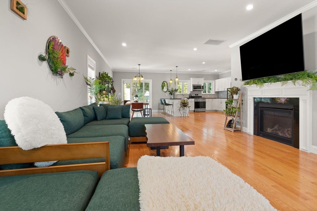 Dining room, Fireplace, Interior, Kitchen, Living room, Pendant Lights, Recessed Lighting, Stainless Steel Appliances, Wood Texture Flooring